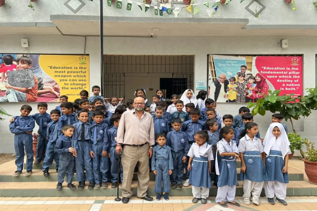 Teacher successfully leading a large, engaged class of students, symbolizing the long-term career impact and international recognition of QTS.