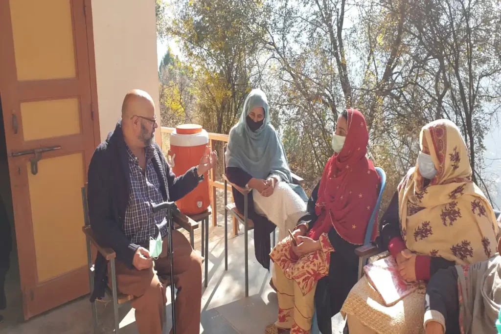 A small group of international teachers receiving personalized training and guidance on the QTS certification process.