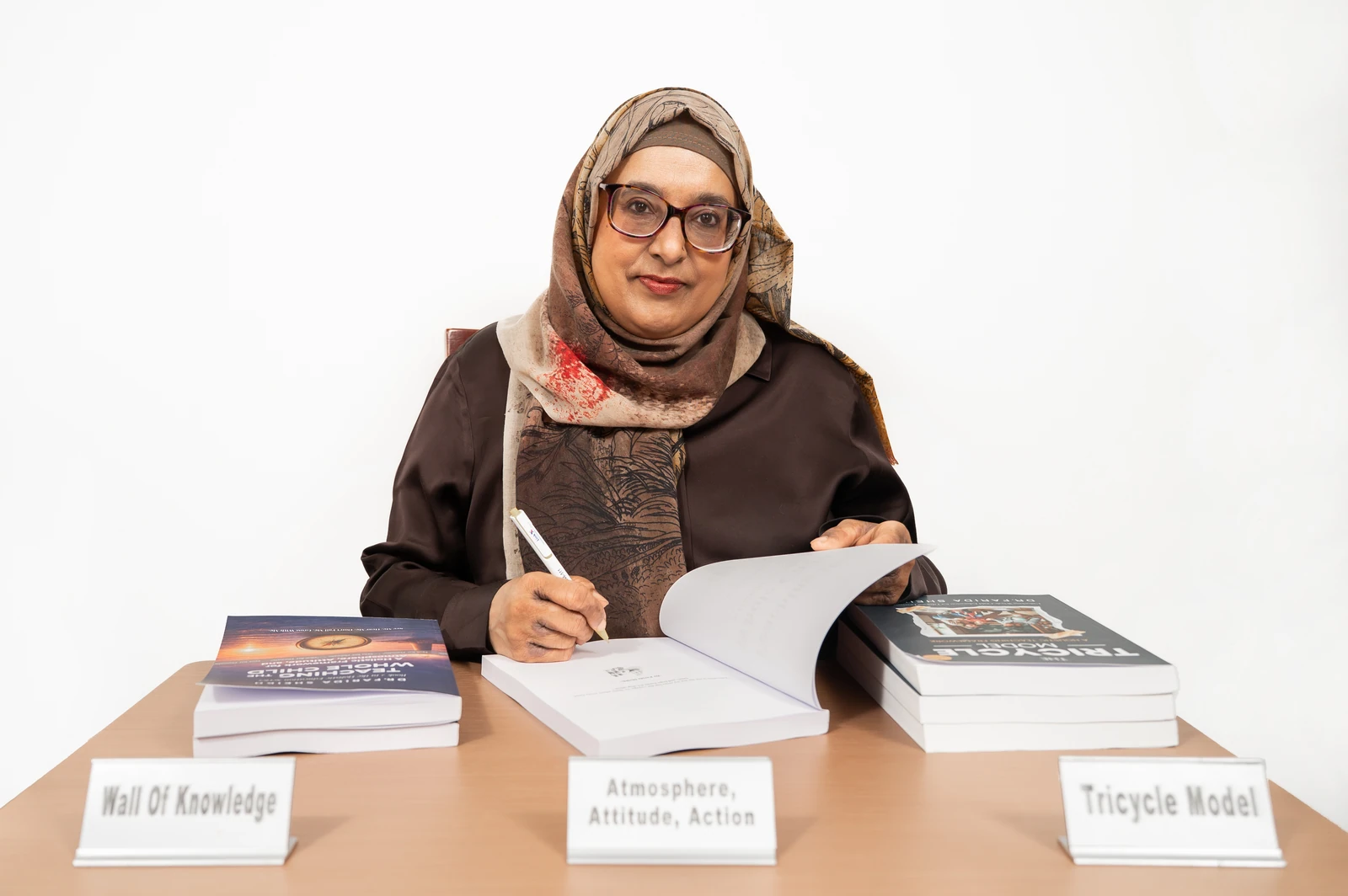 Projects 2 Dr Farida Sheikh writing at a desk